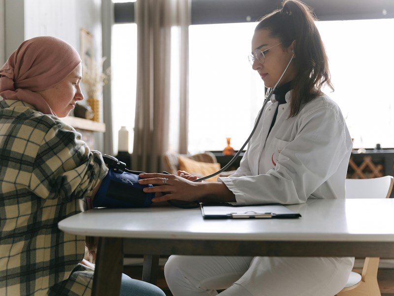 A nurse checking someone's blood